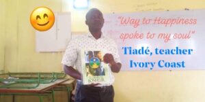 Tiade teaching his class in Ivory Coast about the Way to Happiness, Happiness and Self Improvement